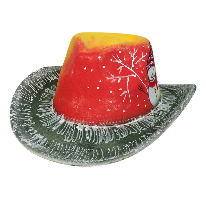 A festive cowboy hat with a red and yellow top featuring a snowman and tree design, green brim with white accents, and a textured, frosty appearance.