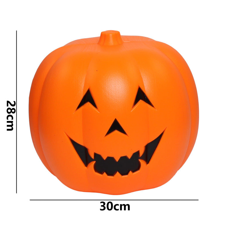 Smiling orange pumpkin decoration with triangular eyes and jagged mouth, measuring 28cm in height and 30cm in width, ideal for Halloween festivities.