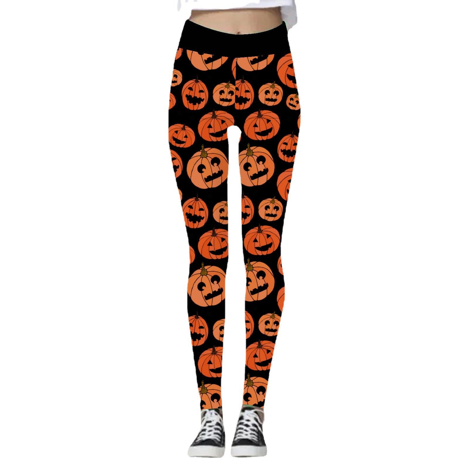 Black leggings featuring an all-over pattern of orange jack-o'-lanterns with various facial expressions. Worn with black and white sneakers.
