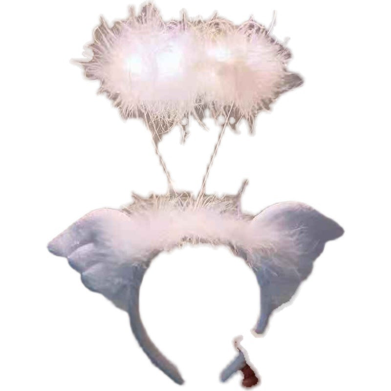 Fluffy white angel halo and wings headband, featuring soft feathers and delicate design, perfect for costumes or festive occasions, set against a plain white background.