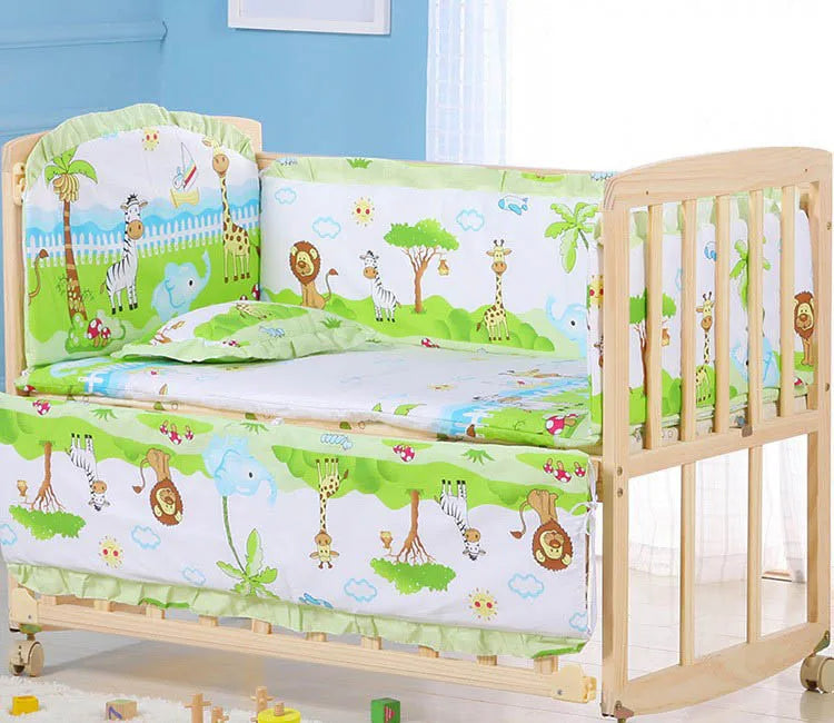 Wooden baby crib with a colorful jungle-themed bedding set featuring animals like giraffes, zebras, and lions. Bright and cheerful nursery decor with soft toy blocks nearby.
