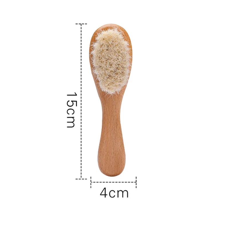 Wooden baby hairbrush with soft bristles, measuring 15 cm long and 4 cm wide. Ideal for gentle grooming.