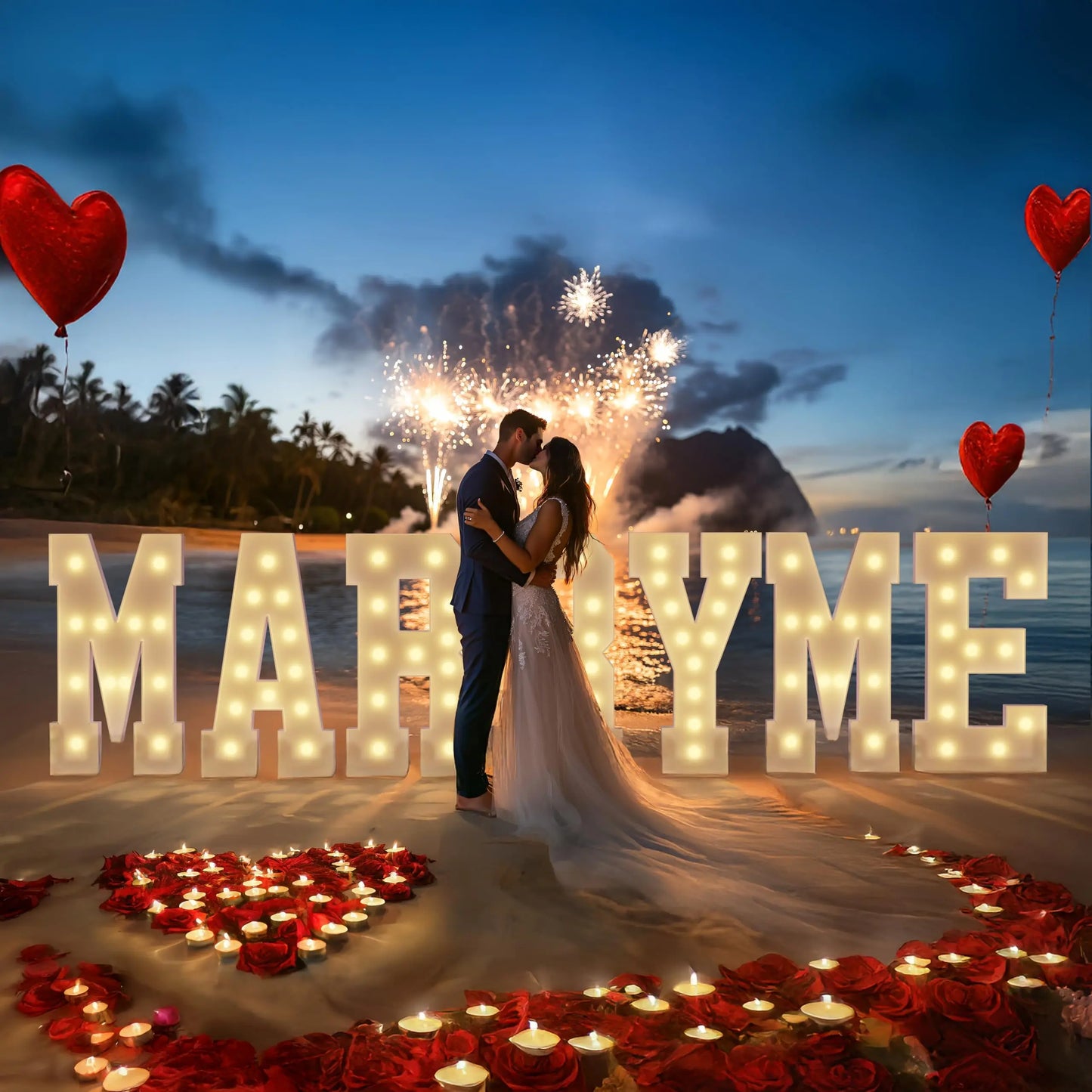 A couple embraces on a beach at sunset, framed by illuminated "Marry Me" letters. Fireworks light the sky, with heart-shaped balloons and candles arranged in a heart on the sand.