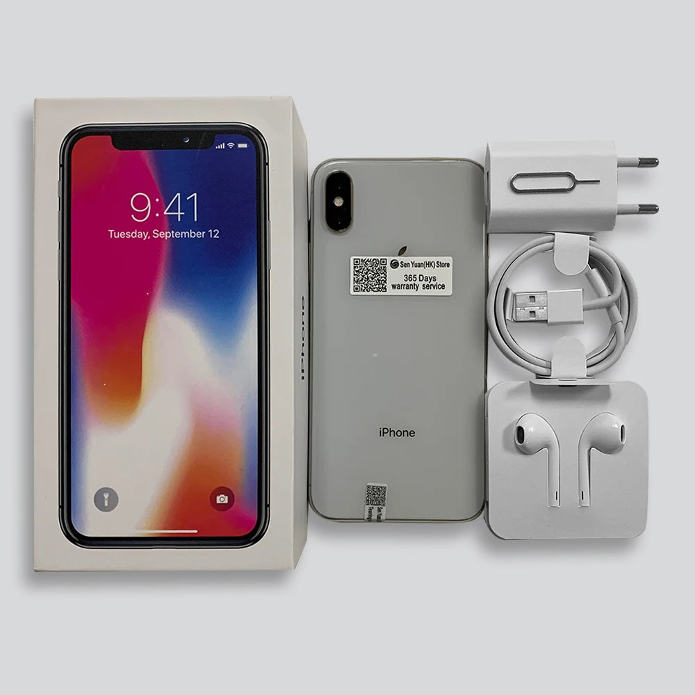 Boxed smartphone with display showing 9:41, date September 12. Includes phone, warranty sticker, charger, USB cable, SIM eject tool, and EarPods, all against a gray background.