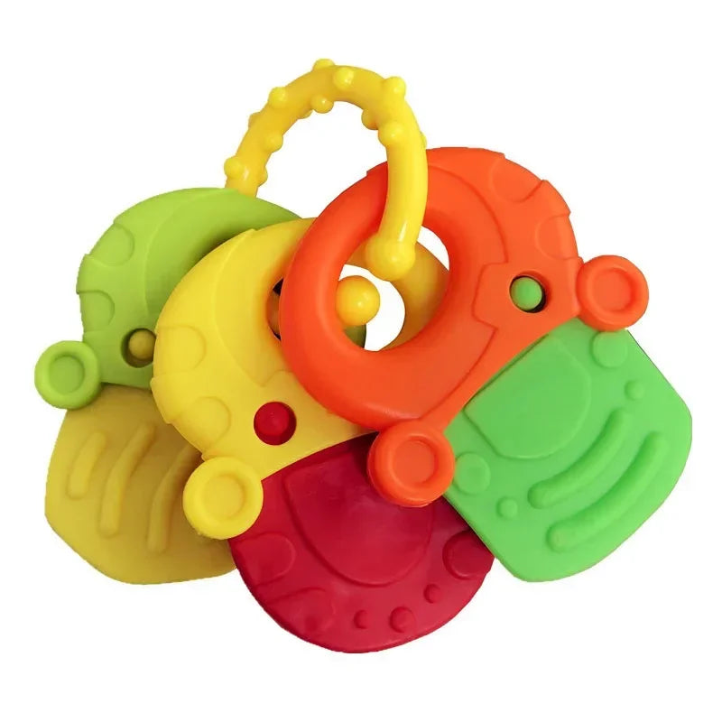 Colorful teething toy with four rubber keys in green, yellow, orange, and red, attached to a yellow ring, featuring textures and raised patterns for sensory stimulation.