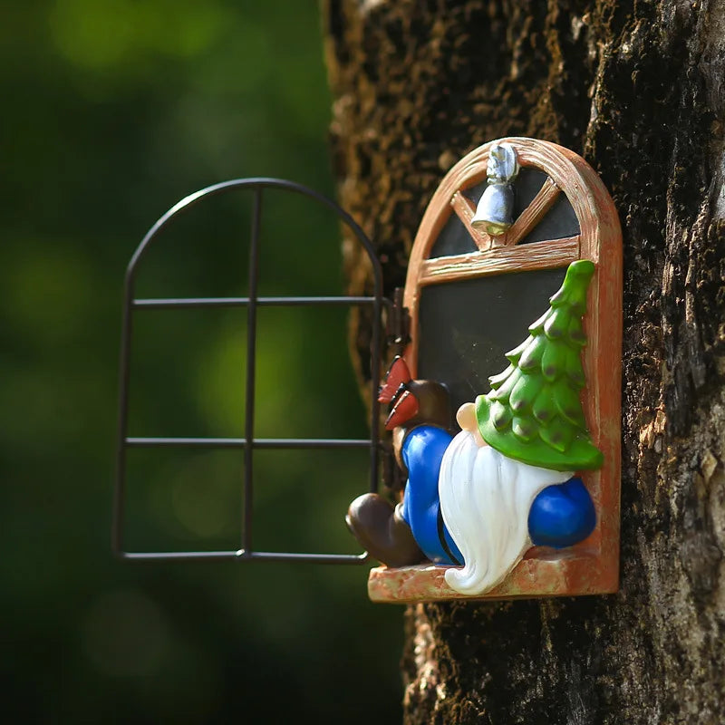 A whimsical gnome with a green tree hat peeks into a miniature window set into a tree trunk. The open window reveals a small blackboard, with a green, blurred outdoor background.
