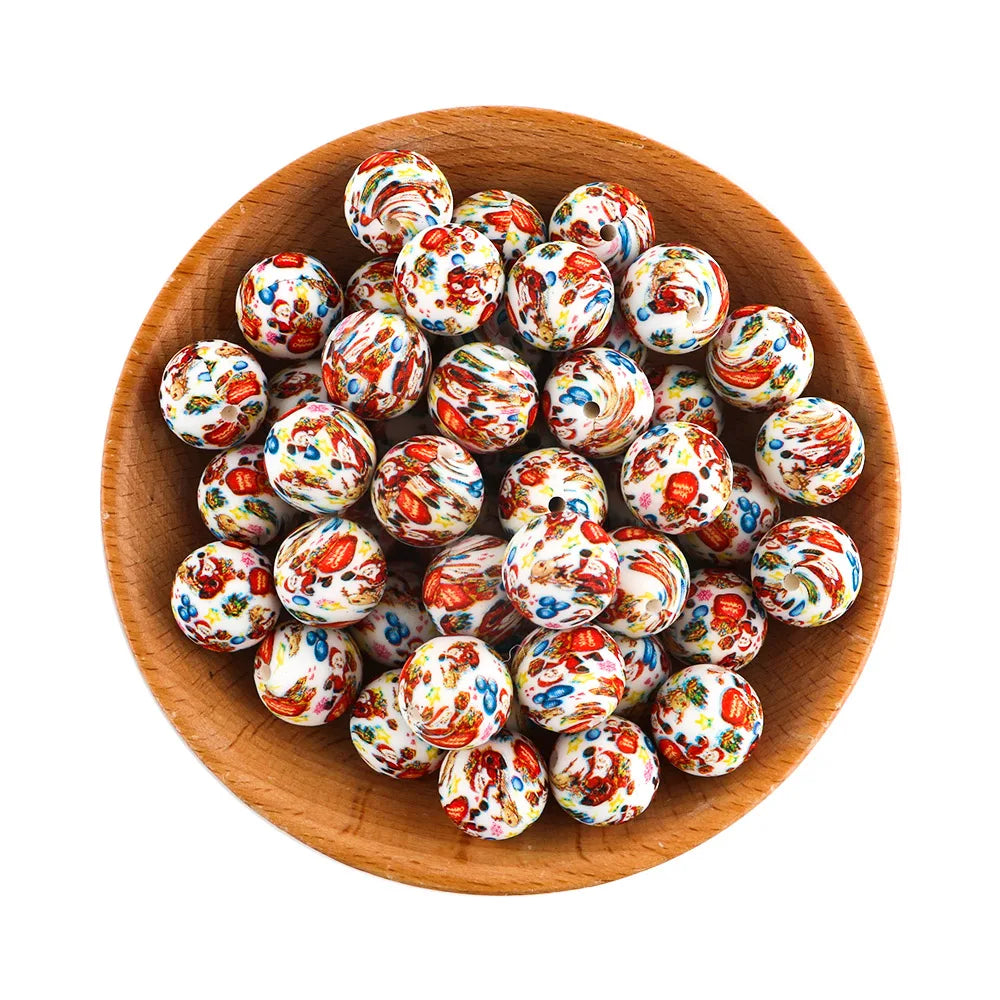 A wooden bowl filled with colorful, intricately patterned round beads. The beads feature swirling red, blue, yellow, and white designs, creating a vibrant mosaic effect.