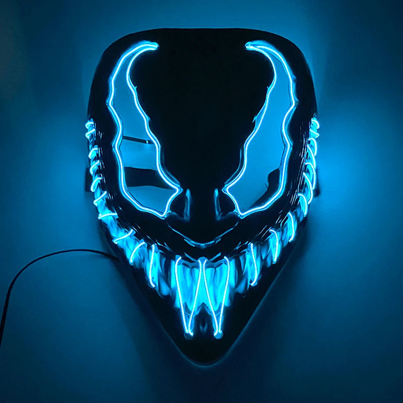 Glowing neon mask with sharp teeth and expressive eyes, illuminated in blue light against a dark background. The design is dramatic and eye-catching, resembling a sinister face.