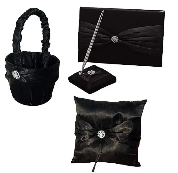 Black satin wedding set with rhinestone accents, includes a basket, guest book, pen on a stand, and a ring pillow. Each item is elegantly wrapped with pleated fabric.