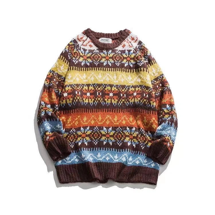 Colorful knitted sweater with geometric patterns in brown, yellow, orange, and blue horizontal stripes. The design features intricate motifs and a cozy fit.