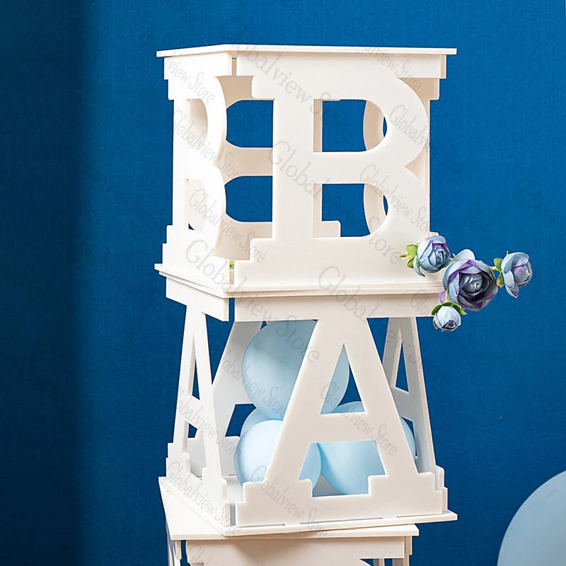 Stacked white decorative blocks with letters "B" and "A", containing light blue balloons. Blue background with purple and blue flower accents on the side.