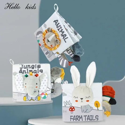 Three soft fabric baby books titled "Animal," "Jungle Animals," and "Farm Tails" with plush animal features, displayed against a blue background.