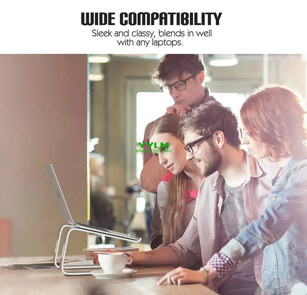 A group of four people looking at a laptop on a sleek metal stand in a modern office. The text above reads, "Wide Compatibility: Sleek and classy, blends in well with any laptops."