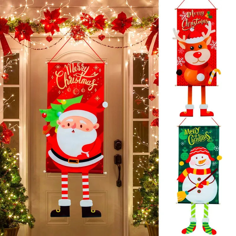 Festive door decorated with a Santa banner. Red poinsettias and white lights adorn the entrance. Two additional banners feature a reindeer and snowman beside the door.