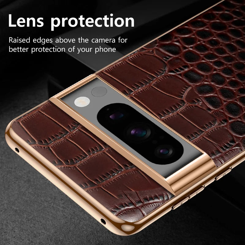 Close-up of a smartphone with a brown crocodile-patterned case. The raised edges provide lens protection. Text reads, "Lens protection: Raised edges for better protection."
