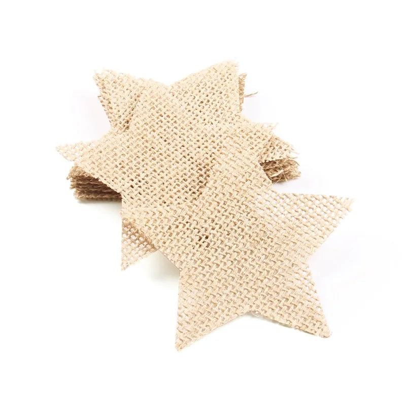 A pile of beige burlap stars on a white background, featuring a woven texture and earthy tone, suitable for crafts or decoration.