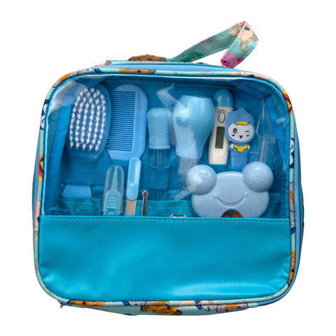 A blue, transparent baby grooming kit with a comb, brush, nail clippers, scissors, thermometer, and tweezers, all neatly organized in a zippered case with a handle.