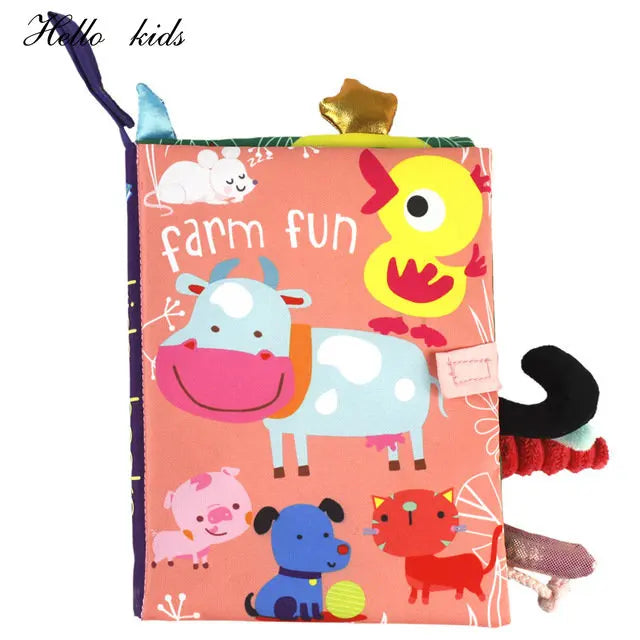 Colorful children's fabric book titled "Farm Fun" featuring illustrations of a cow, duck, pig, dog, cat, and mouse on a pink background with tactile elements protruding.