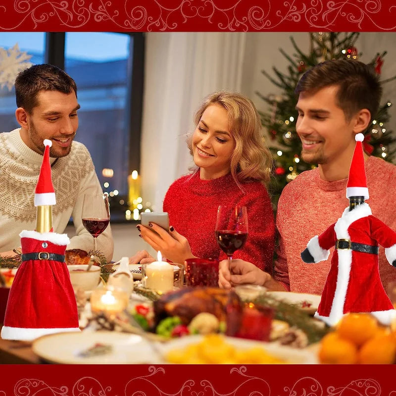 Three people in festive attire enjoy a Christmas dinner with wine. The table features candles, holiday decorations, and Santa-clad wine bottles, with a lit tree in the background.