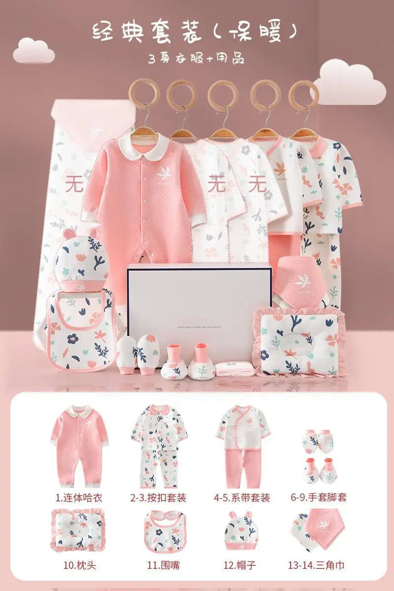 Baby clothing set displayed on a pink background, featuring various items including onesies, socks, hats, bibs, and a blanket with floral and pink designs.