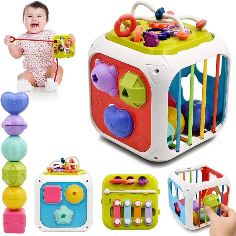 A baby holding a cube activity toy with colorful shapes, musical bars, and bead maze. The cube features various sensory activities on each side, alongside a stack of colorful geometric shapes.