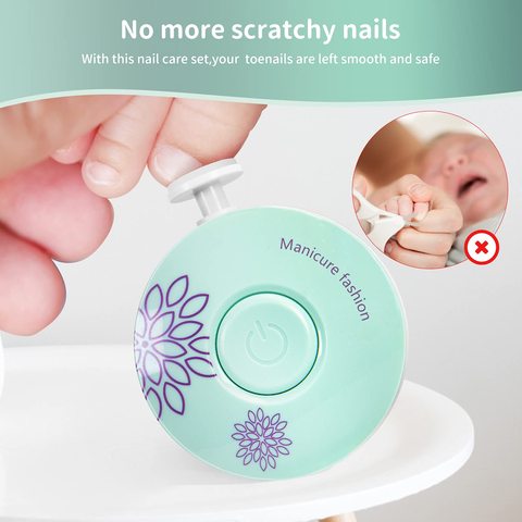 Close-up of a handheld electric nail filer with floral design, gently filing a baby's nails. Text above reads: "No more scratchy nails" with a warning icon on baby's uncut nails.