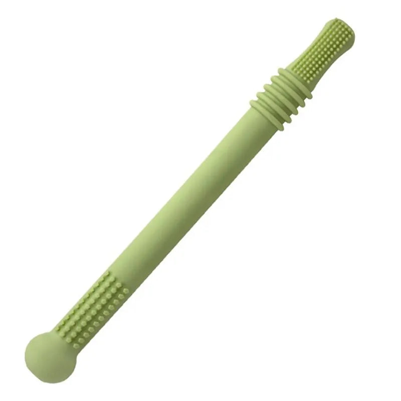 Green silicone chew stick with textured grips on both ends, one rounded and the other ribbed, designed for sensory and oral motor development activities.