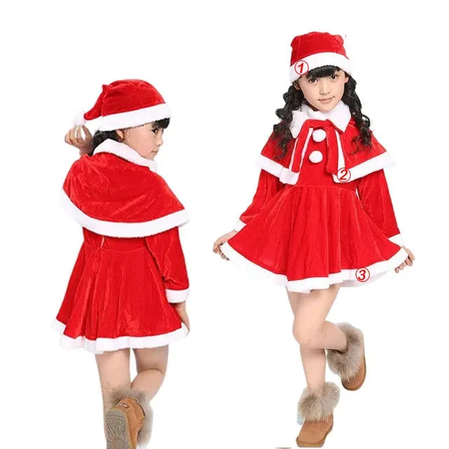 Two young girls wearing red and white Santa outfits with furry boots. One is facing forward and the other is turned away, both in festive hats with white trim.