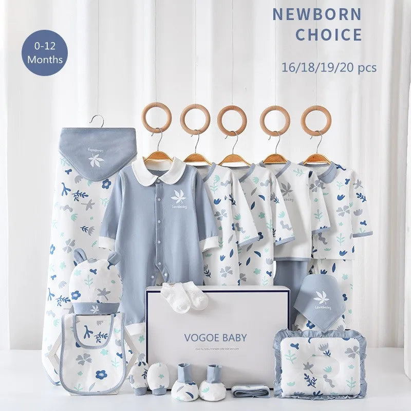 Baby clothing set for 0-12 months, featuring blue and white onesies, blankets, socks, a bib, and a plush toy. Displayed with "Vogoe Baby" branding on a white backdrop.