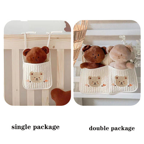 Single package with one brown teddy bear in a pocket, and double package with a brown and beige teddy bear in two pockets, both hanging from a crib.