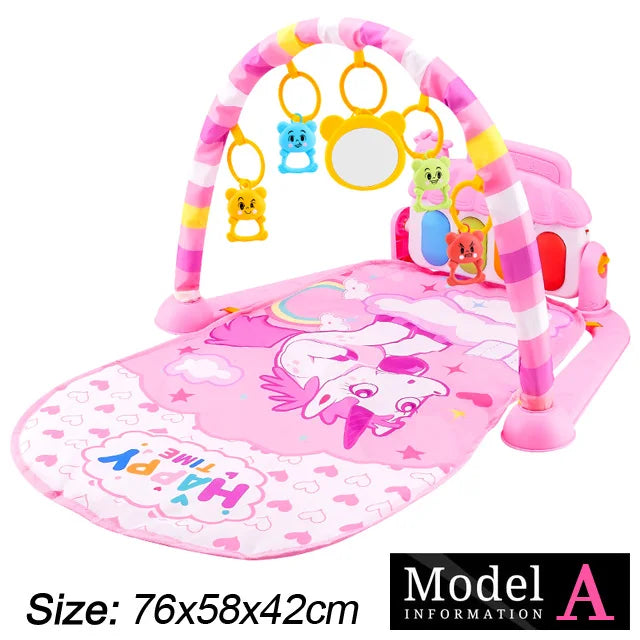 Pink baby play mat with unicorn design, featuring an arch with hanging toys and a mirror. Dimensions: 76x58x42cm. Text reads "Happy Time" and "Model A."