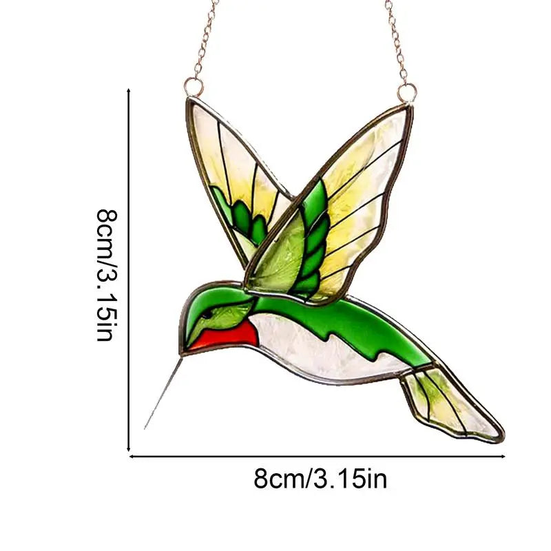 Stained glass hummingbird suncatcher with green and yellow wings. Measuring 8 cm by 8 cm (3.15 in), displayed with a metal chain for hanging.