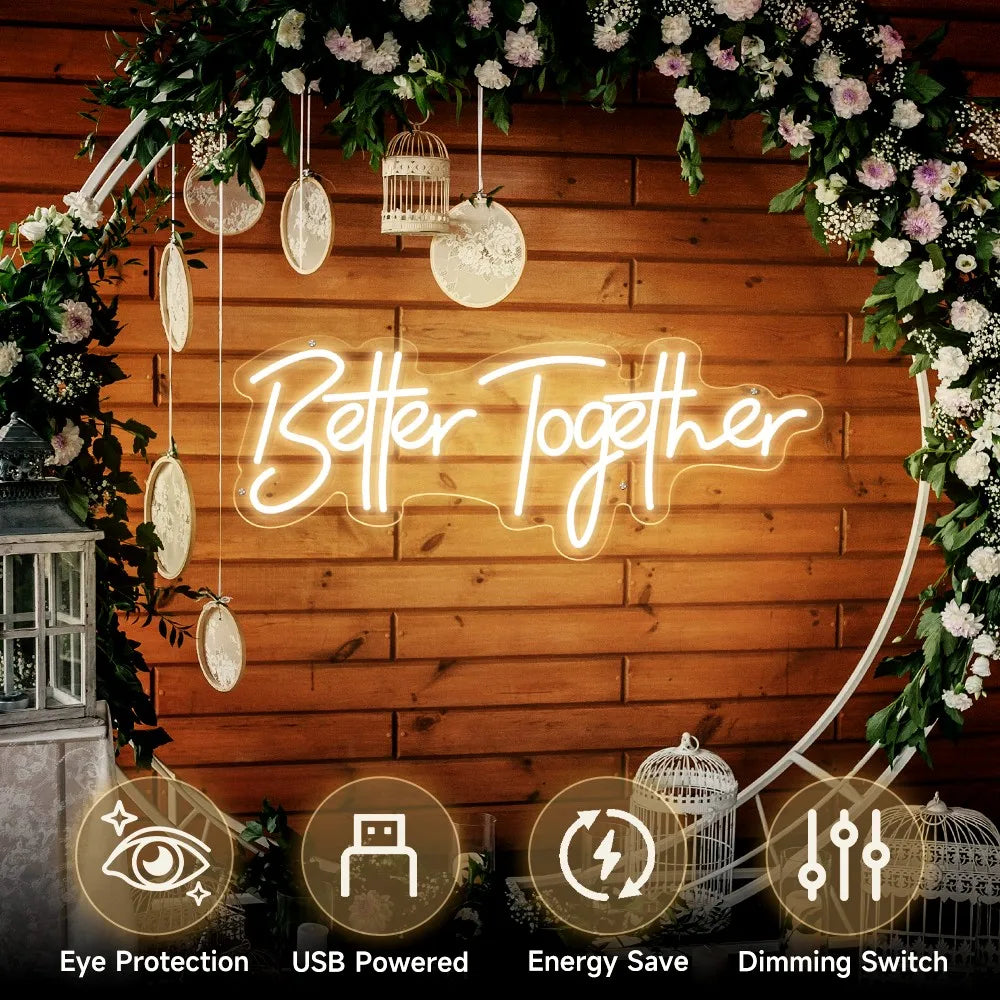 A neon sign reading "Better Together" on a wooden wall, adorned with floral and birdcage decorations. Icons below indicate features: eye protection, USB powered, energy-saving, dimming switch.