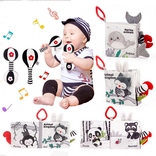 A baby in a striped outfit plays with black-and-white rattles. Surrounding the baby are musical notes and soft animal-themed cloth books with illustrations of a dolphin, monkey, owl, panda, and raccoon.