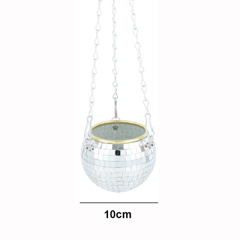 Small disco ball planter with silver mirrored tiles, hanging by three chains. The planter is 10cm in diameter, featuring a gold rim at the top.