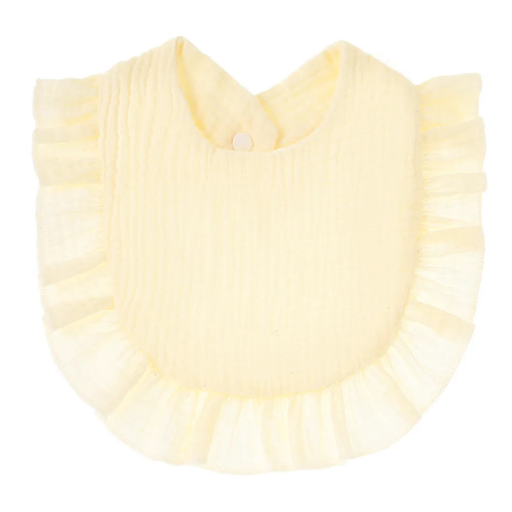 Light yellow baby bib with soft ruffled edges and a button closure at the back.