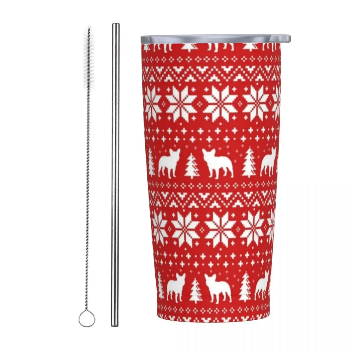 Red tumbler with white snowflakes, dogs, and trees pattern, accompanied by a metal straw and a cleaning brush.