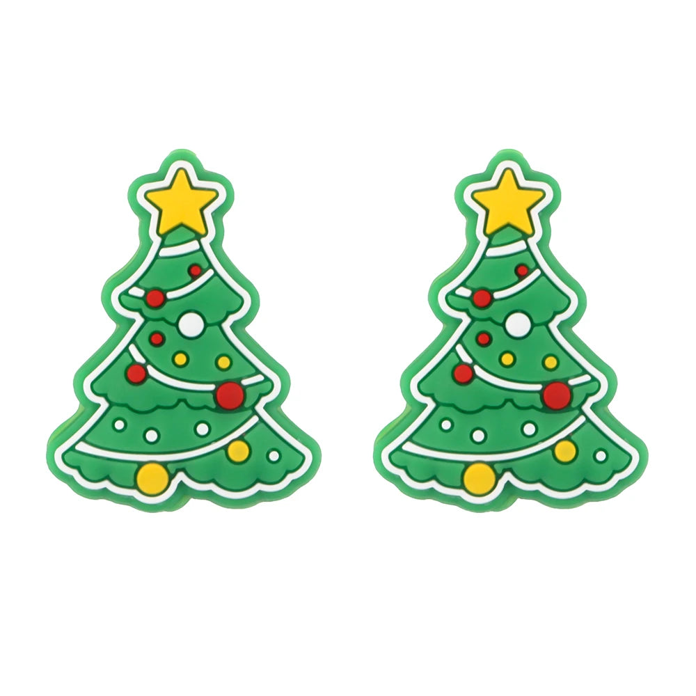 Two stylized Christmas tree illustrations with yellow star toppers, red and yellow ornaments, and garlands on a green base, outlined in white and green.