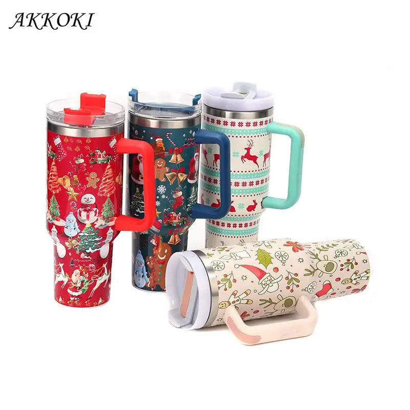 Four festive travel mugs with colorful Christmas designs, including reindeer, Santa, and holly. Each mug features a different colored handle and lid, perfect for the holiday season.