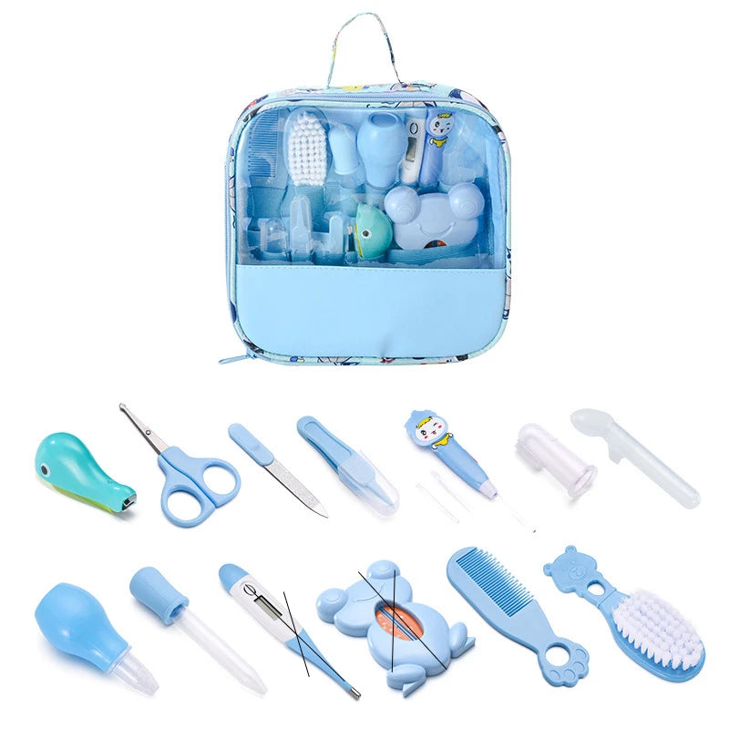Blue baby grooming kit with a transparent pouch, containing various tools including comb, brush, thermometer, nail clippers, scissors, and nasal aspirator.