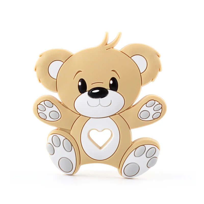 Cartoon-style beige teddy bear with big eyes, smiling face, and white paws. It features a heart cut-out on its belly and is sitting with open arms and legs.