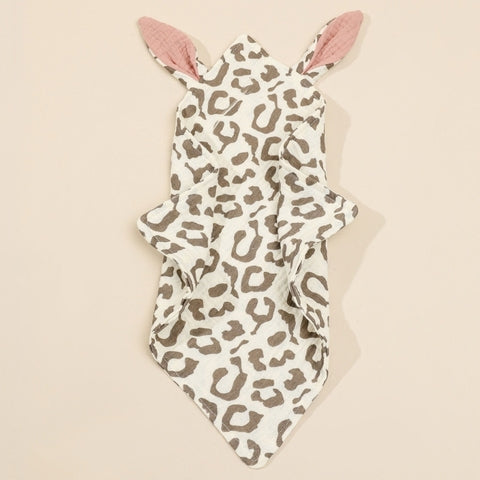 Cream-colored hooded baby towel with a brown leopard print and pink inner ears. The towel has a playful animal ear design at the top, adding a cute touch for infants.
