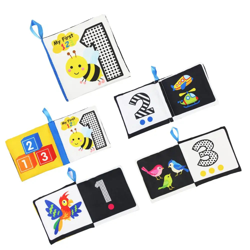 Children's cloth book set with colorful pages featuring numbers and playful illustrations like a bee, helicopter, birds, and butterfly.
