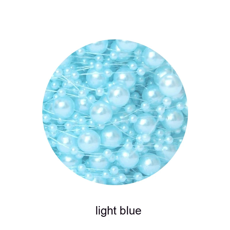 Close-up of light blue glossy beads grouped together, displaying various sizes and a shiny surface. Text below reads "light blue."