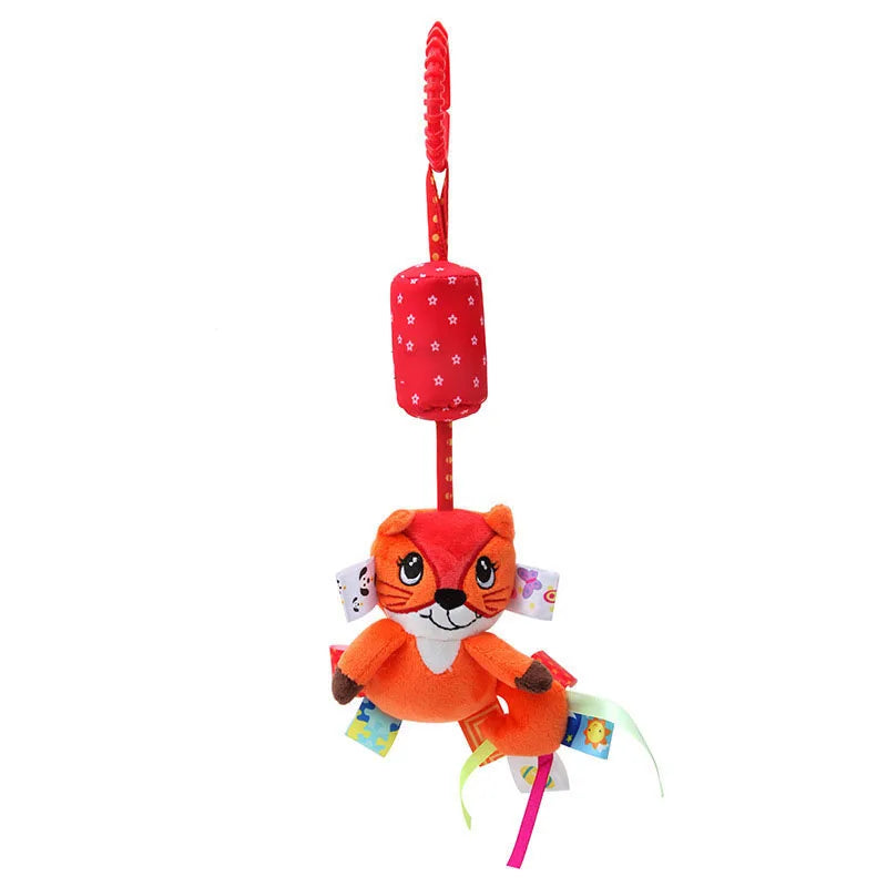 Colorful plush toy of an orange, smiling fox with patchwork details and ribbons, hanging from a red star-patterned handle.