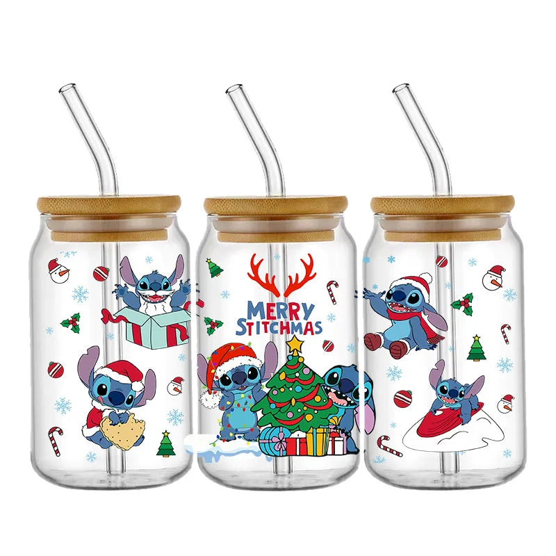 Three glass jars with bamboo lids and straws feature a blue alien character in Christmas settings. Festive text reads "Merry Stitchmas" with decorations and holiday scenes.