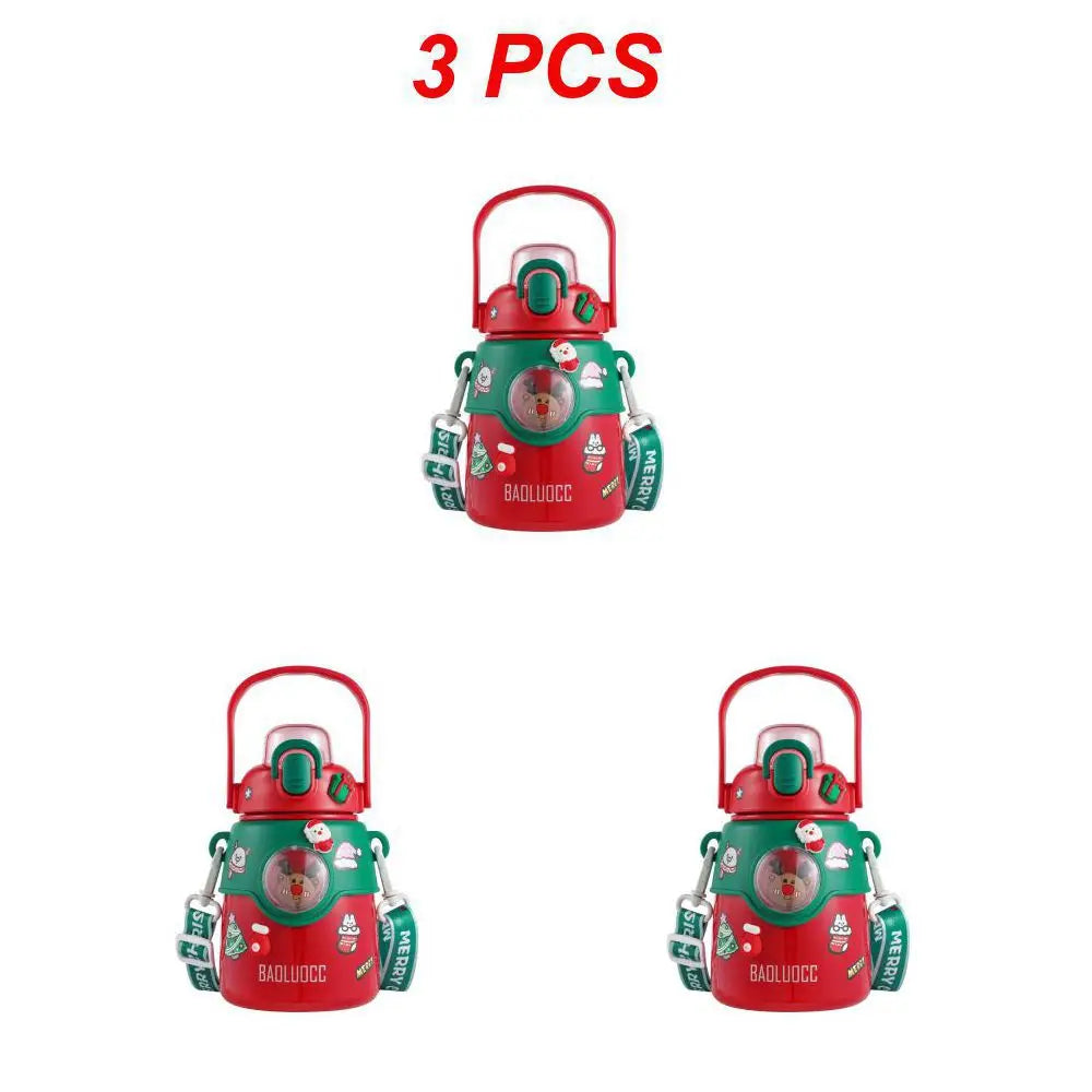 Three festive red and green water bottles with holiday-themed stickers, green straps, and red handles. Bold red text above reads "3 PCS" on a white background.