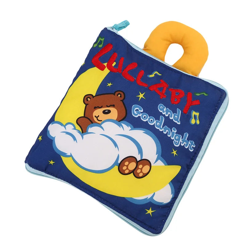 Soft baby book with a teddy bear on a moon, surrounded by stars and musical notes. The cover reads "Lullaby and Goodnight." The book has a yellow handle for easy grip.