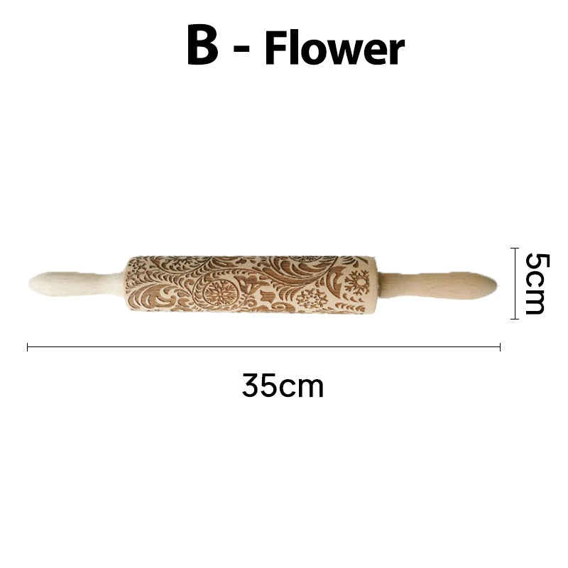 Ornate rolling pin with floral engravings. Dimensions: 35cm length, 5cm diameter. Handles on both sides. Ideal for decorative baking. Labeled "B - Flower."