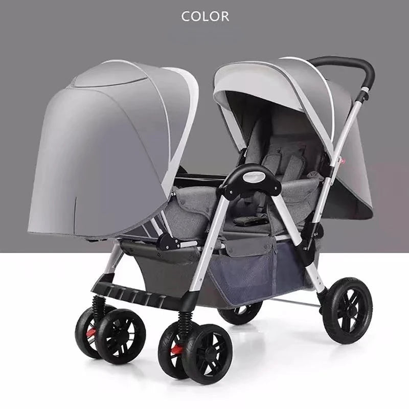 Gray double stroller with adjustable canopies, black handles, and storage basket, shown against a gray background. Suitable for twins or siblings, with four wheels for stability.